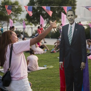 Friends take a selfie with a cardboard cut out of US president Barack Obama in Hong Kong. Photo: AFP