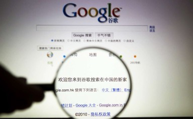 A person poses with a magnifying glass in front of a Google search page. Photo: Reuters A person poses with a magnifying glass in front of a Google search page. Photo: Reuters