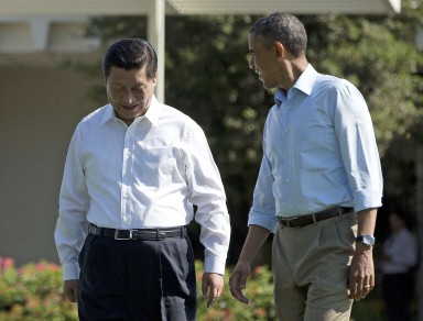 Chinese President Xi Jinping, left, walks with President Barack Obama at Sunnylands estate in California in June 2013. Photo: AP