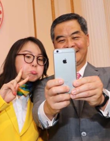 Chief Executive CY Leung takes a selfie with China Olympic swimmer Fu Yuanhui – he might have to start paying a bit more attention to sport if he runs again in 2017.