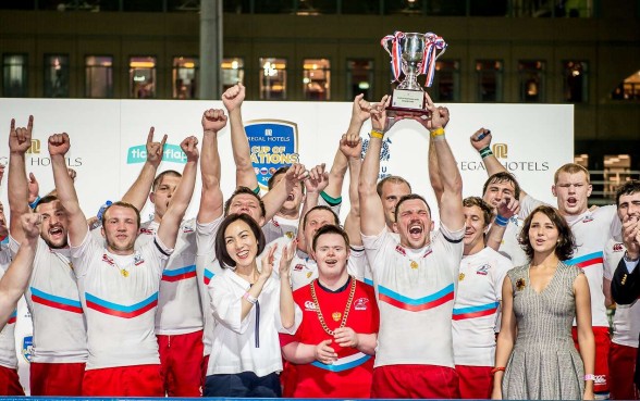 Russia captain Vasily Artemyev is surrounded by his team as he lifts the Cup of Nations for a second straight year after his side’s 27-0 win over Hong Kong at Hong Kong Football Club on Saturday evening. Photos: SCMP Pictures