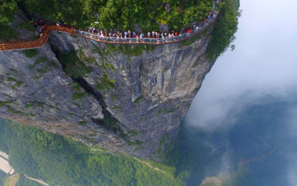 People walk on a sightseeing platform in Zhangjiajie, Hunan. Photo: Reuters
