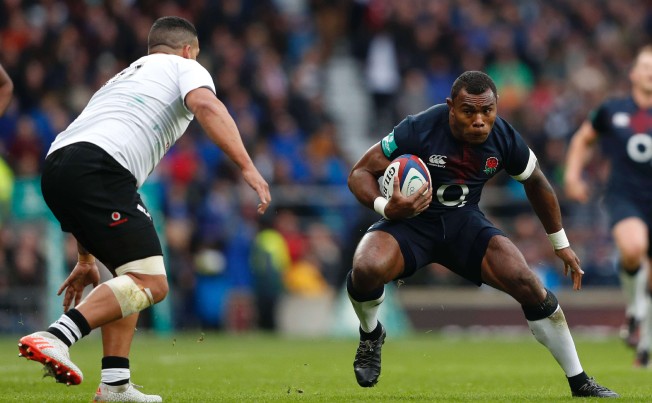 England winger Semesa Rokoduguni tests the Fiji defence as his side romp to a 58-15 win at Twickenham on Saturday. Photo: AFP