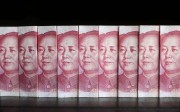 Chinese 100 yuan banknotes. China’s debt burden is growing faster than its economy and is a risk to the continent’s economy, analysts say. Photo Reuters, Jason Lee