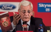 China's newly appointed national football team coach Marcello Lippi gestures during a press conference in Beijing on October 28, 2016. World Cup-winning Italian manager Marcello Lippi held first news conference on October 28 after his appointment as coach of China's struggling national football team. / AFP PHOTO / NICOLAS ASFOURI