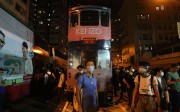 Protesters outside Western Police Station on Sunday evening in Hong Kong. There were repeated clashes between officers and protesters who had had broken off from an earlier, peaceful rally against Beijing's Basic Law interpretation over the Legco oath-taking row. Photo: AFP Protesters outside Western Police Station on Sunday evening in Hong Kong. There were repeated clashes between officers and protesters who had had broken off from an earlier, peaceful rally against Beijing's Basic Law interpretation over the Legco oath-taking row. Photo: AFP