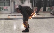 Man tries to extinguish flames after a firebomb sets off blaze in Hong Kong’s MTR. Photo: Facebook Man tries to extinguish flames after a firebomb sets off blaze in Hong Kong’s MTR. Photo: Facebook