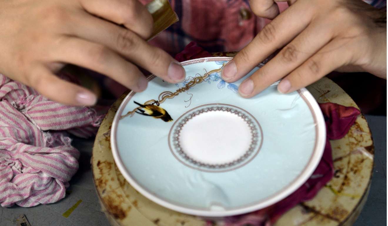 A worker applies decals to a ceramic plate in Zibo, Shandong province, earlier this month. Zibo is well known for its production and export of porcelain. China has prospered on the back of its successful export-led strategy. Today, the world’s largest exporter may well be in the vanguard of global decoupling. Photo: Xinhua