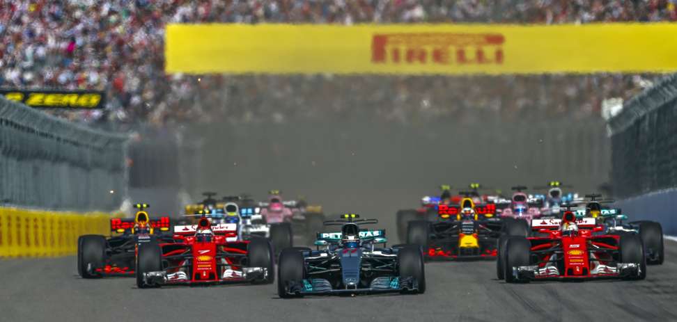 Valtteri Bottas (centre) takes his Mercedes to the lead in a spectacular start to the Russian Grand Prix. Photo: EPA