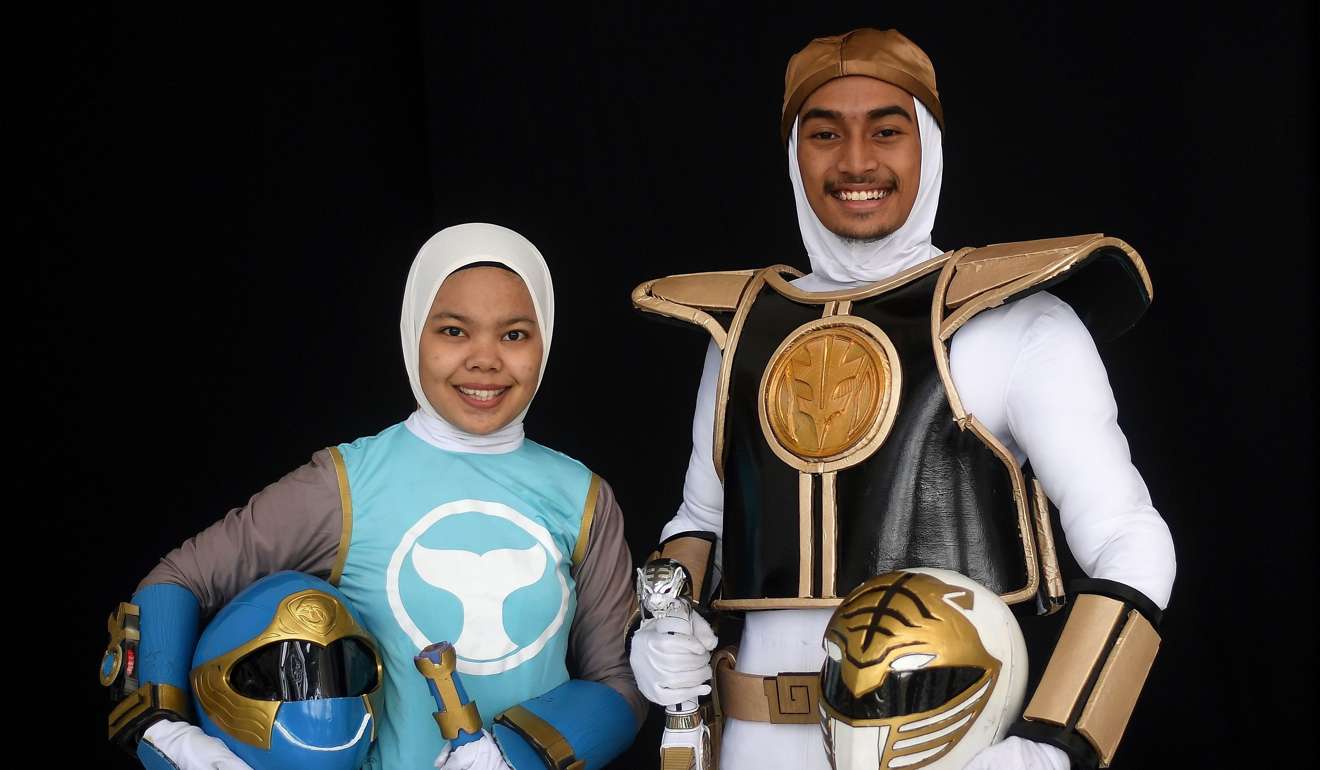 Muslim cosplay enthusiasts Azlyna Zaina (left) and Raja Muhammad Rusydi, dressed as Power Rangers at the cosplay event in Subang Jaya. Rusydi hopes more Muslim women will take up cosplay. Photo: AFP