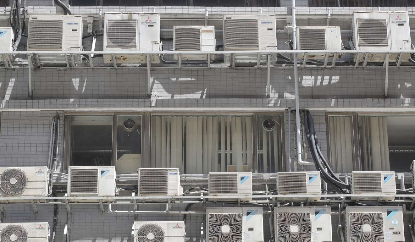Air conditioners line the ledges of an industrial building at Lai Chi Kok. An obsession with air conditioning sees the machines consume almost 30 per cent of Hong Kong’s energy supply each year. Photo: Paul Yeung