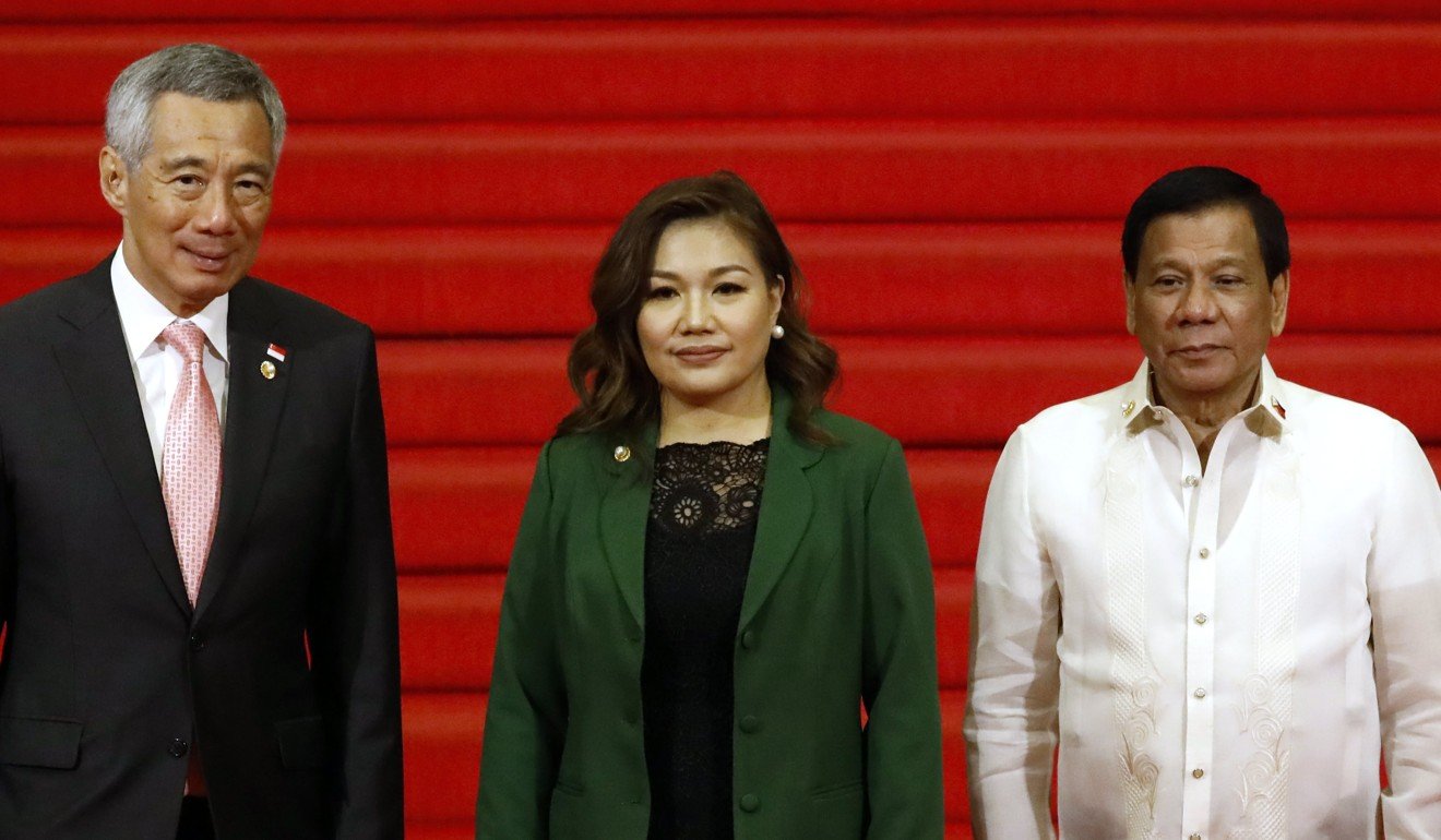 Philippines President Rodrigo Duterte, right, and his partner Honeylet Avancena with Singapore Prime Minister Lee Hsien Loong at the Philippine International Convention Centre.The Philippines hosted the Asean 2017 Summit. Photo: EPA