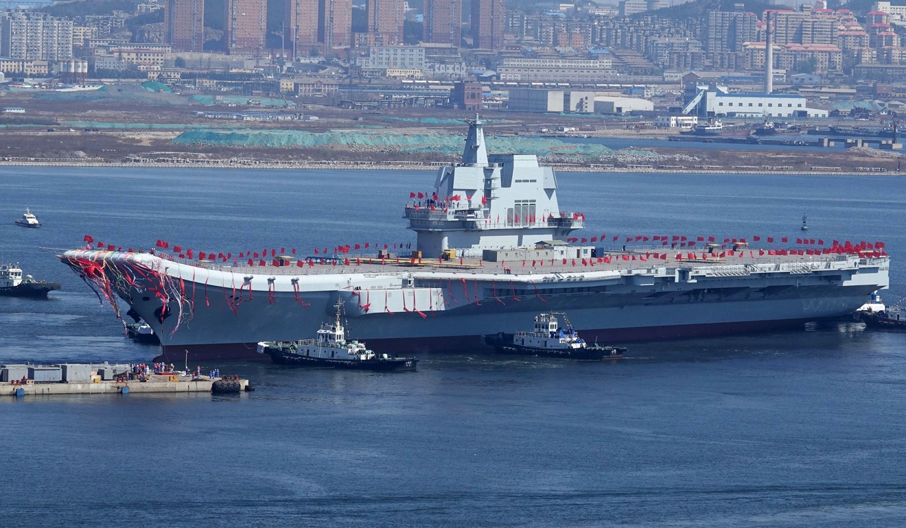 The Type 001A is transferred from dry dock into the water during a launch ceremony at the Dalian shipyard in Liaoning province, on April 26. It is China’s first domestically designed and built aircraft carrier. Photo: AFP