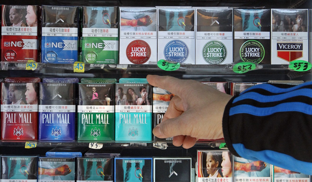 Warnings now cover 50 per cent of cigarette packets. Photo: Edward Wong
