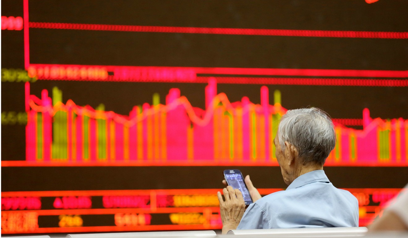 An investor sits at a stock trading hall in Beijing. Photo: Xinhua