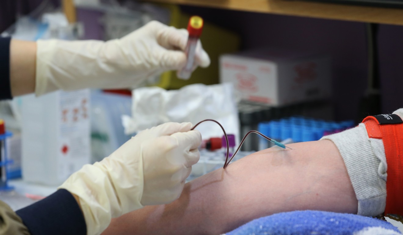 A nurse takes blood sample at United Christian Hospital in Kwun Tong. Photo: Dickson Lee