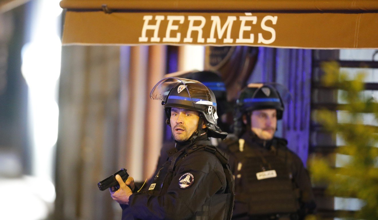 Just as candidates were making their final pitches to voters in a televised interview show on April 20, a gunman opened fire on police on the Champs Elysees, killing one officer before being shot dead himself. Photo: EPA