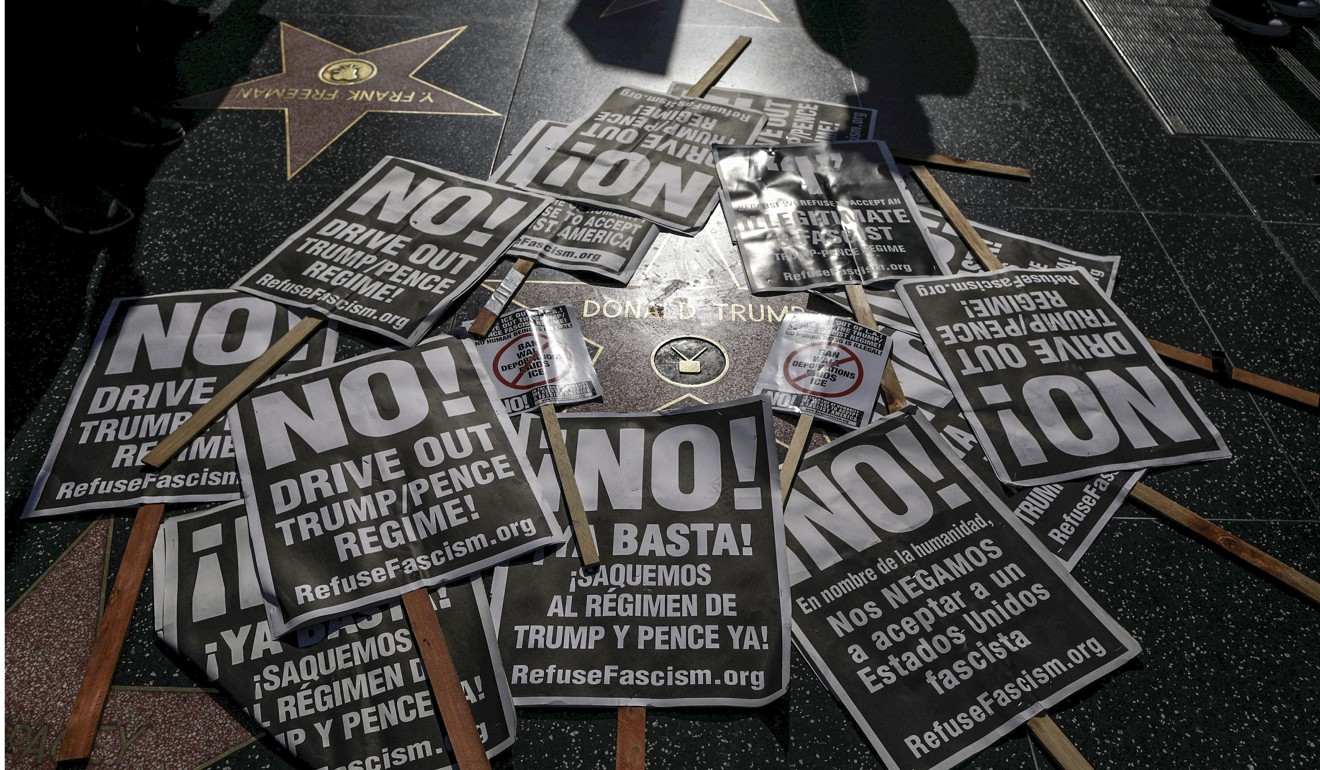 People protest against President Donald Trump's firing of FBI Director James Comey, on Trump's star on the Hollywood Walk of Fame in Los Angeles. Photo: Reuters