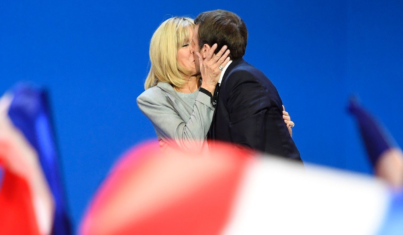 Emmanuel Macron kisses his wife Brigitte after the first round of the presidential election. File photo: AFP