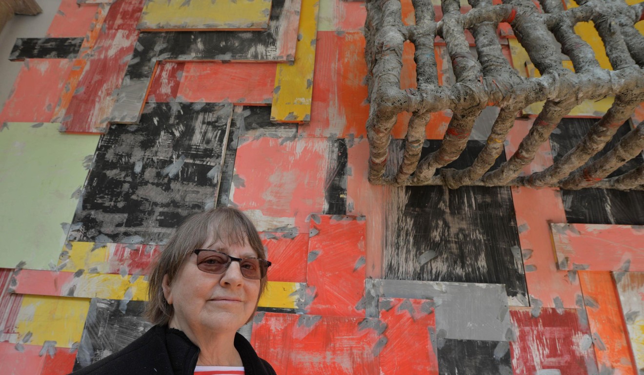 British artist Phyllida Barlow poses next to her work at the Great Britain pavilion. Photo; AP