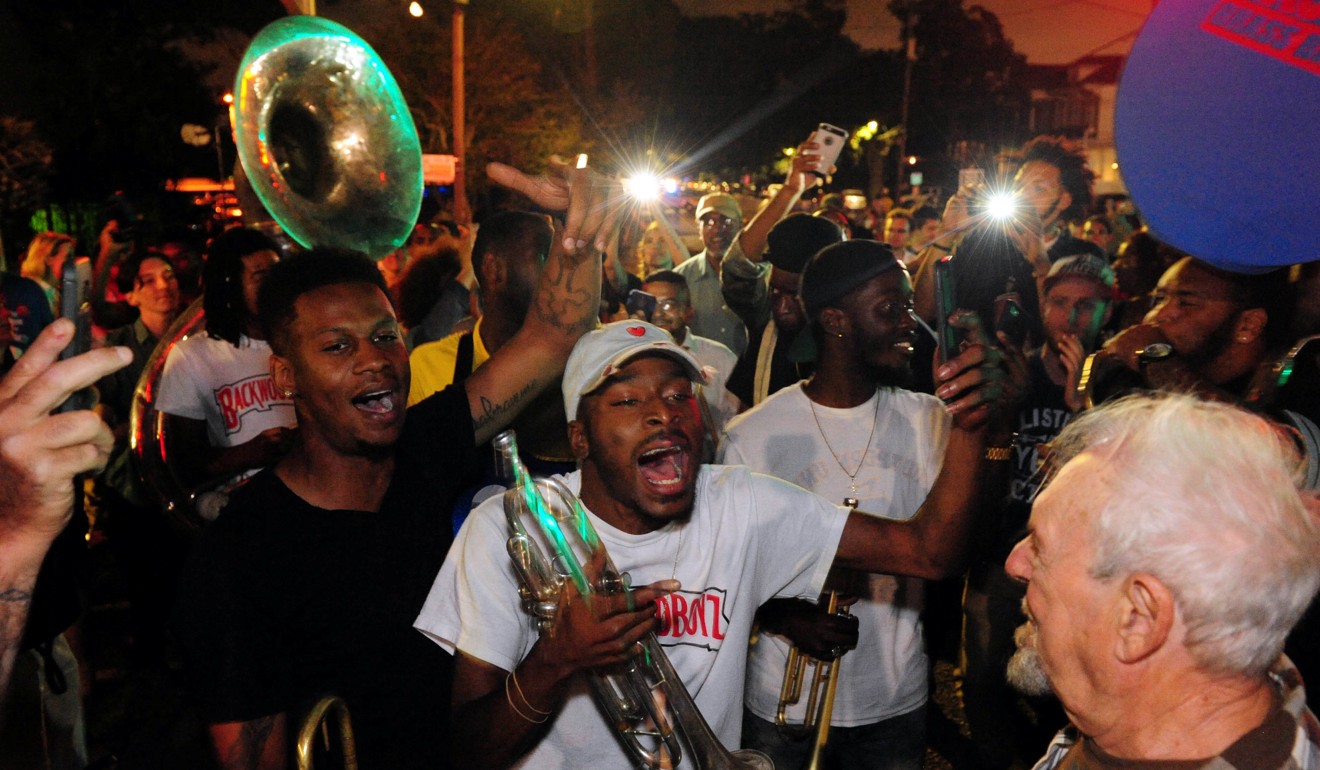 Da Truth Brass Band shows up to support a construction crew working to remove a monument of Confederate General P.G.T Beauregard at the entrance to City Park in New Orleans, Louisiana. Photo: Reuters