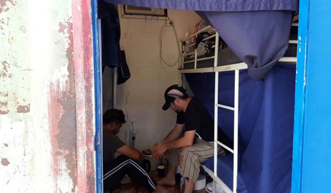 Detainees sit inside accommodation at the Manus Island detention centre in Papua New Guinea. Photo: Reuters