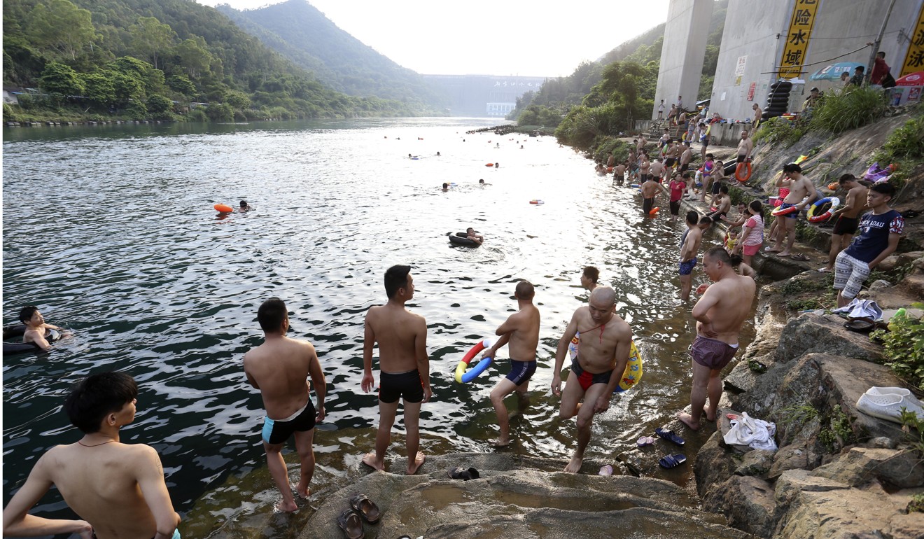 People swimming near the Xinfengjiang dam in Heyuan city, Guangdong. Heyuan is located at the upper middle stream of the Dongjiang. Hong Kong is facing intense competition for the Dongjiang water as neighbouring cities and regions in the Pearl River Delta develop and their populations grow. Photo: Dickson Lee