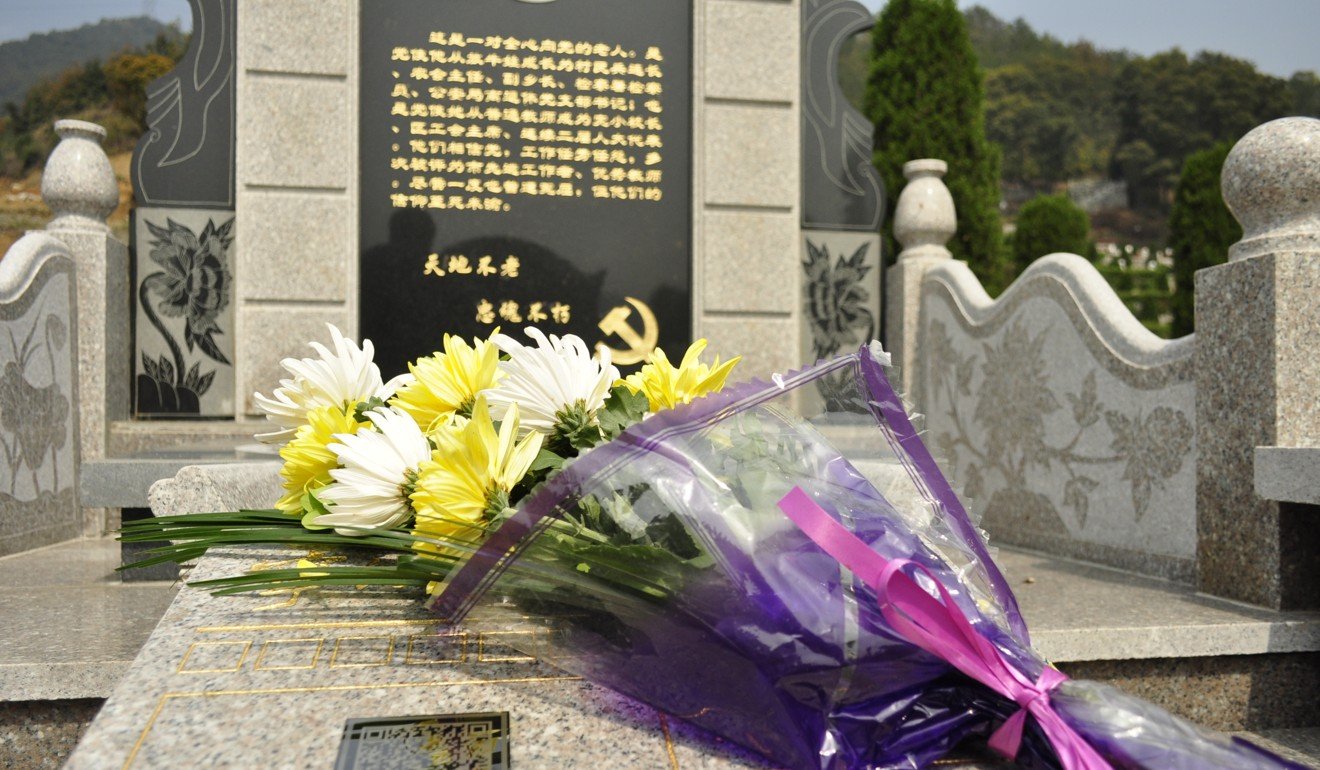 A two-dimensional quick response QR code is affixed to a tombstone in this 2013 file photo to offer smartphone users extended information about the person buried beneath in Ningbo, Zhejiang Province. Photo: ChinaFotoPress