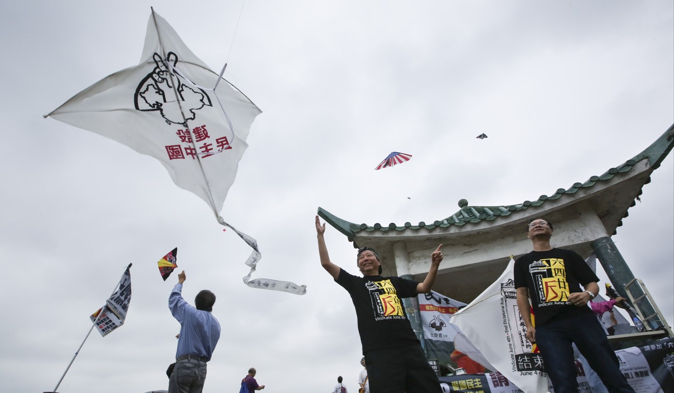 Lee Cheuk-yan (left in black) flies a kite at an event marking the June 4 crackdown. Photo: Sam Tsang