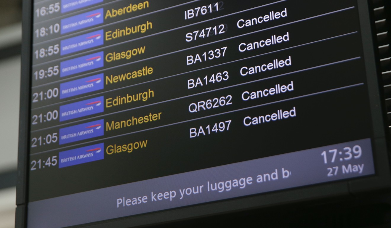 An electronic board shows British Airways flights cancelled at Heathrow Airport Terminal 5 on Saturday. Photo: AFP