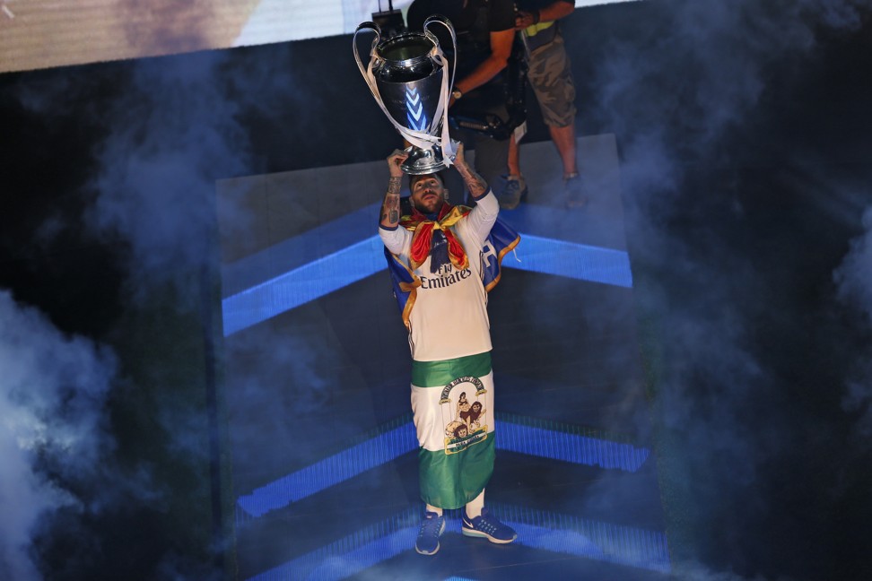 Real Madrid captain Sergio Ramos lifts up the Champions League trophy. Photo: AP