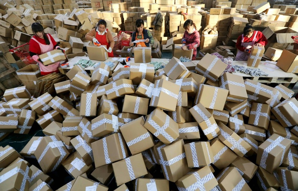 Workers prepare packages for delivery at a sorting center in Lianyungang, Jiangsu province during Alibaba’s Singles’ Day online shopping festival on November 11, 2016. Chinese shoppers unleashed a record deluge of cash online for the 2016 Singles Day, spending 120.7 billion yuan (US$17.8 billion) in the world's biggest online shopping promotion. Photo: AFP