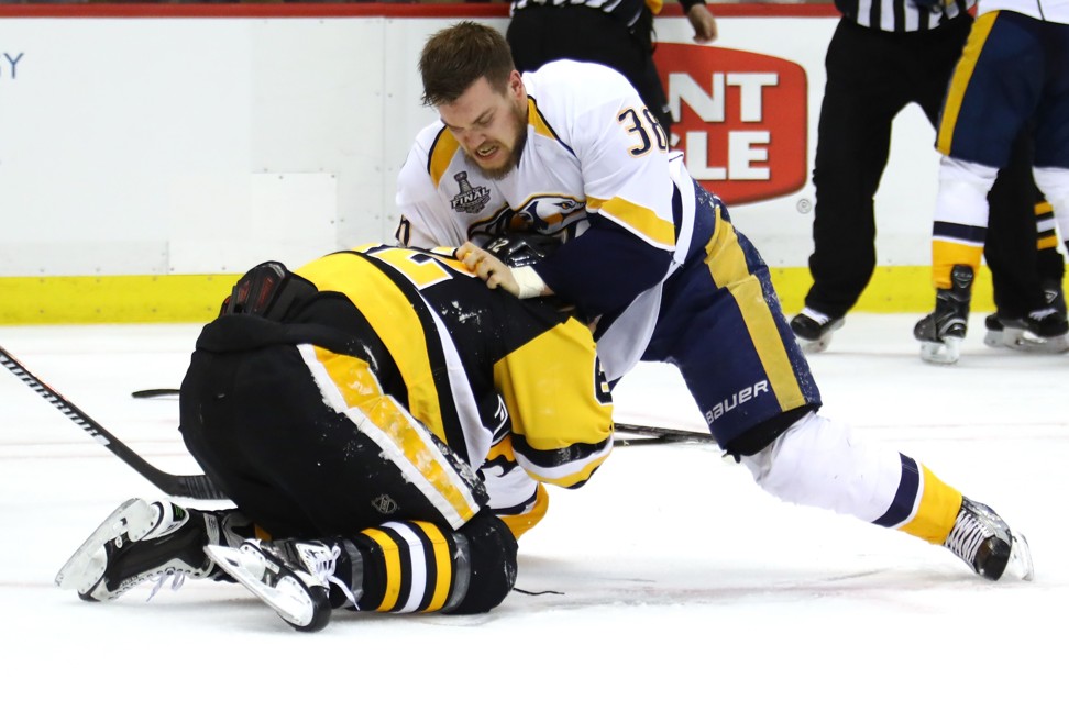 Hagelin and Arvidsson go at it. Photo: AFP