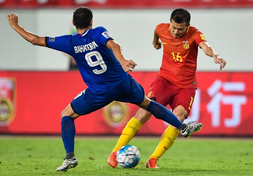 China's Huang Bowen (right) in action against the Philippines. Photo: AFP