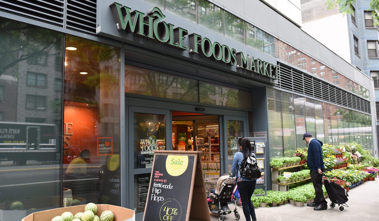 Whole Foods Market (pictured in Midtown New York) is known for its pricey organic options. Amazon is once again shaking up the retail sector with the announcement Friday it will acquire upscale US grocer in a deal that underscores the online giant's growing influence in the economy. Photo: