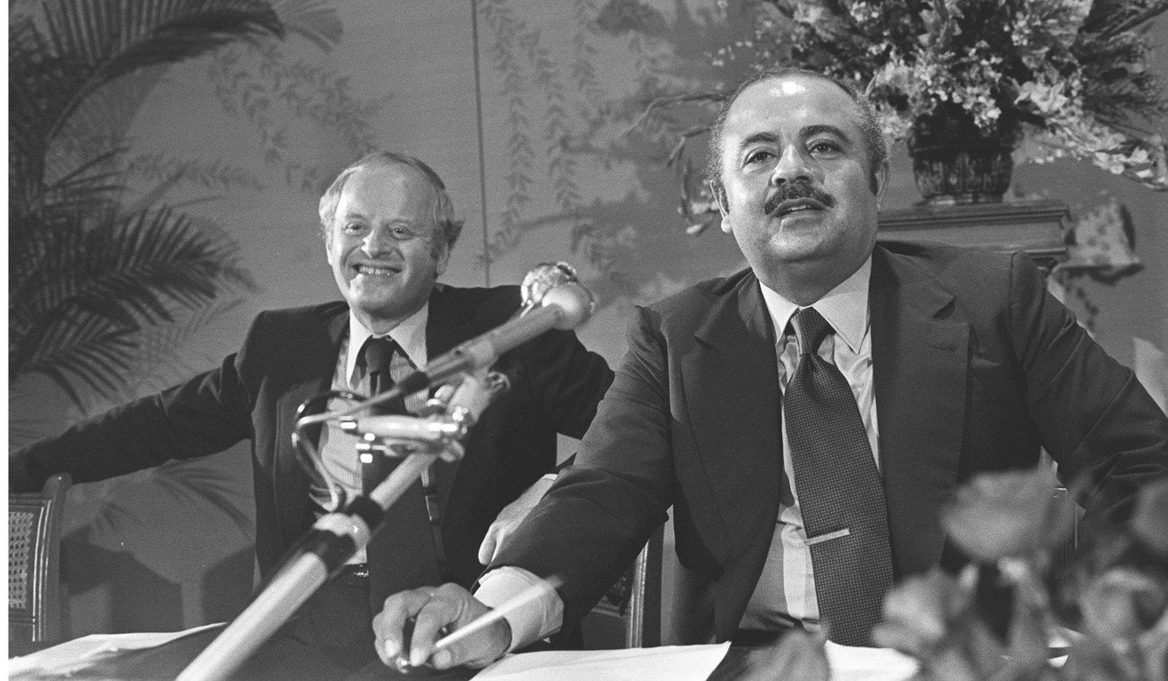 Adnan Khashoggi (right), Chairman of the Triad Holdings Corporation, speaking at the annual general meeting of Southern Pacific Properties in Hong Kong in 1976. Looking on is Peter Munk, Chairman of SSP. Photo: SCMP
