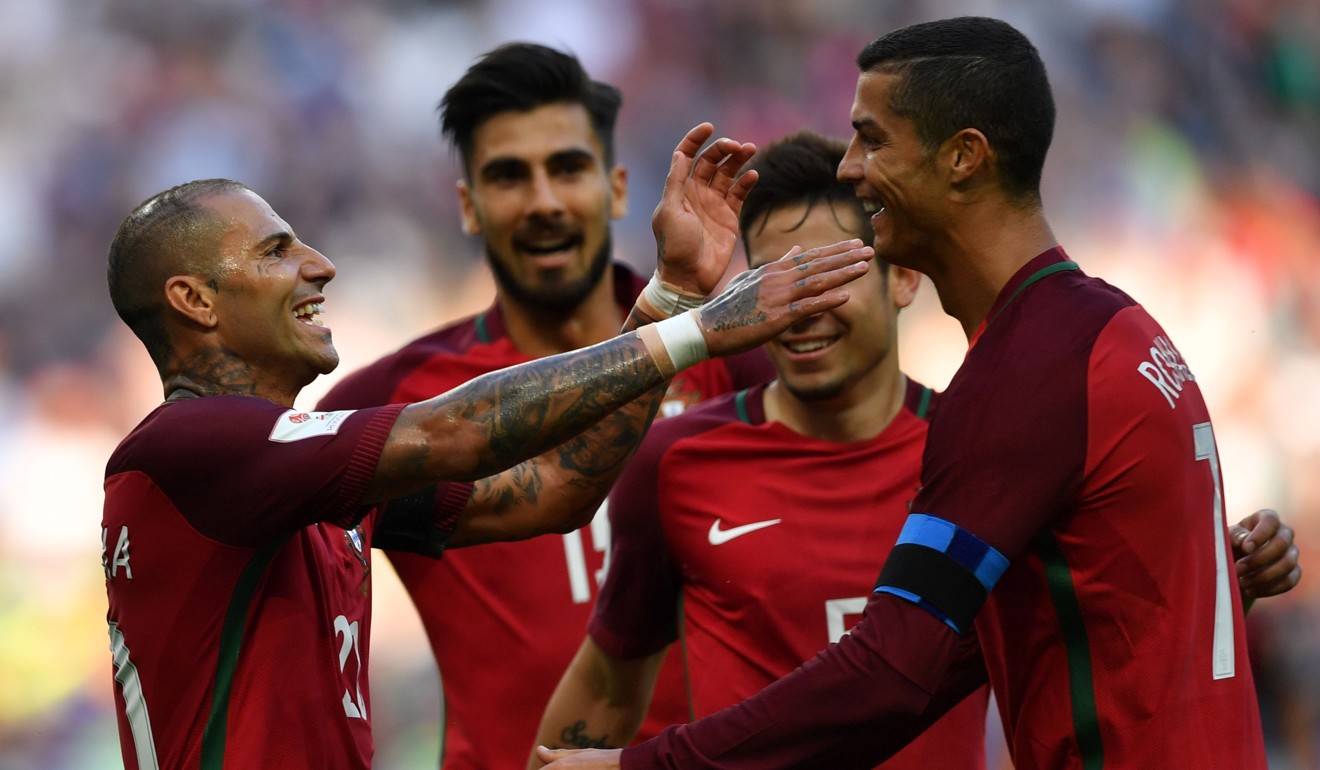 Ricardo Quaresma (left) celebrates with Cristiano Ronaldo after scoring during the Confederations Cup match between Portugal and Mexico at the Kazan Arena. Photo: AFP