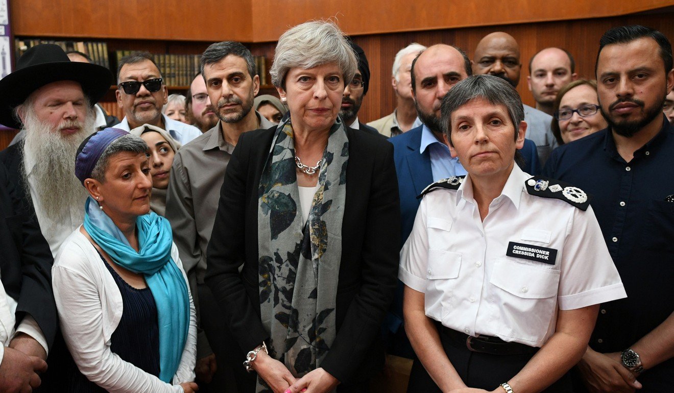 Britain's Prime Minister Theresa May and Metropolitan Police Commissioner, Cressida Dick (centre right) talk to faith leaders at Finsbury Park Mosque. Photo: AFP