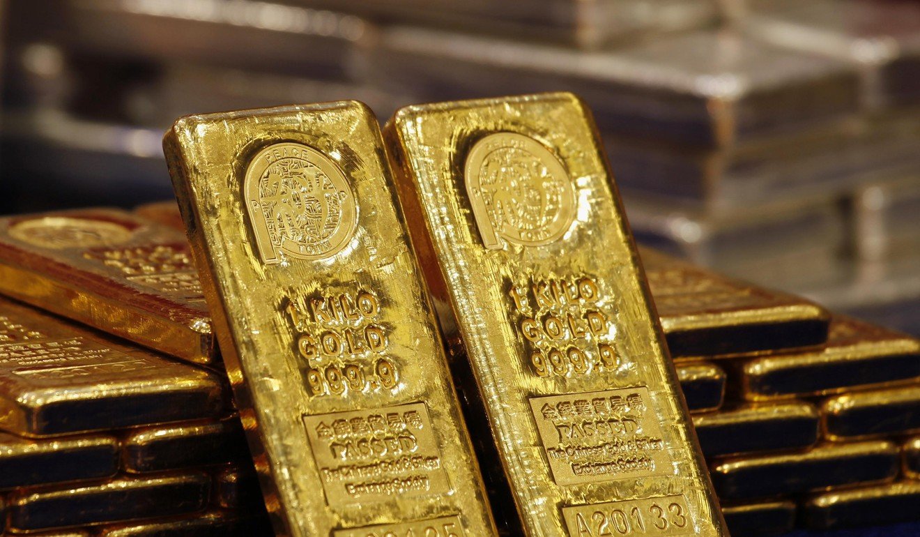One-kg 24K gold bars are displayed at the Chinese Gold and Silver Exchange Society, Hong Kong's major gold and silver exchange. Photo: Reuters