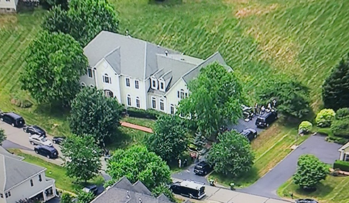 FBI agents raid the home of Kevin Mallory on Thursday, outside Washington. Photo: ABC 7