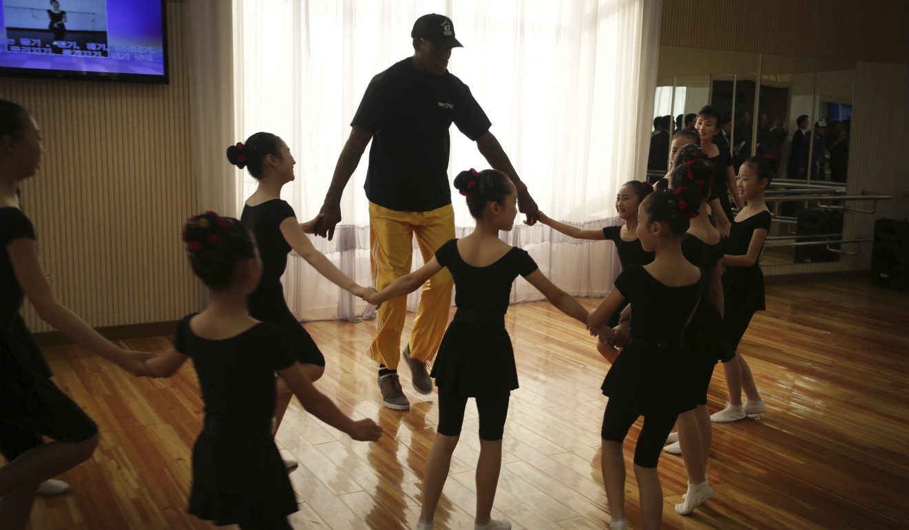 Dennis Rodman dances with school children in Pyongyang. Photo: AP