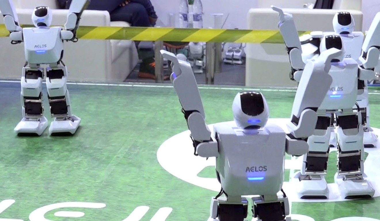 Robots from Shenzhen-based start-up Aelos Robotic perform at the Shanghai CES consumer electronics show, on June 8. More than 50 companies showcased a new generation of robots, most aiming to serve as companions at home or attendants in shopping malls. Photo: AP