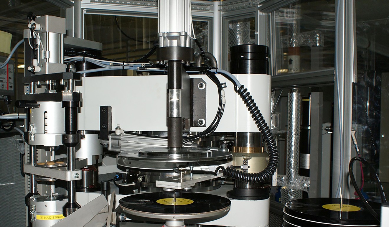 A press and trim machine of vinyl records at Sony DADC Japan Shizuoka factory in Yoshida. Photo: AFP