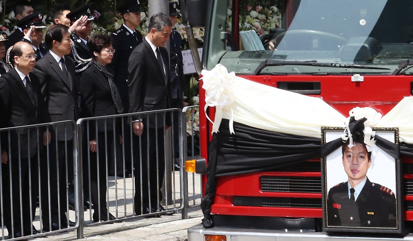Chief Executive Leung Chun-ying at the funeral service of fireman Yau Siu-ming. Photo: Nora Tam