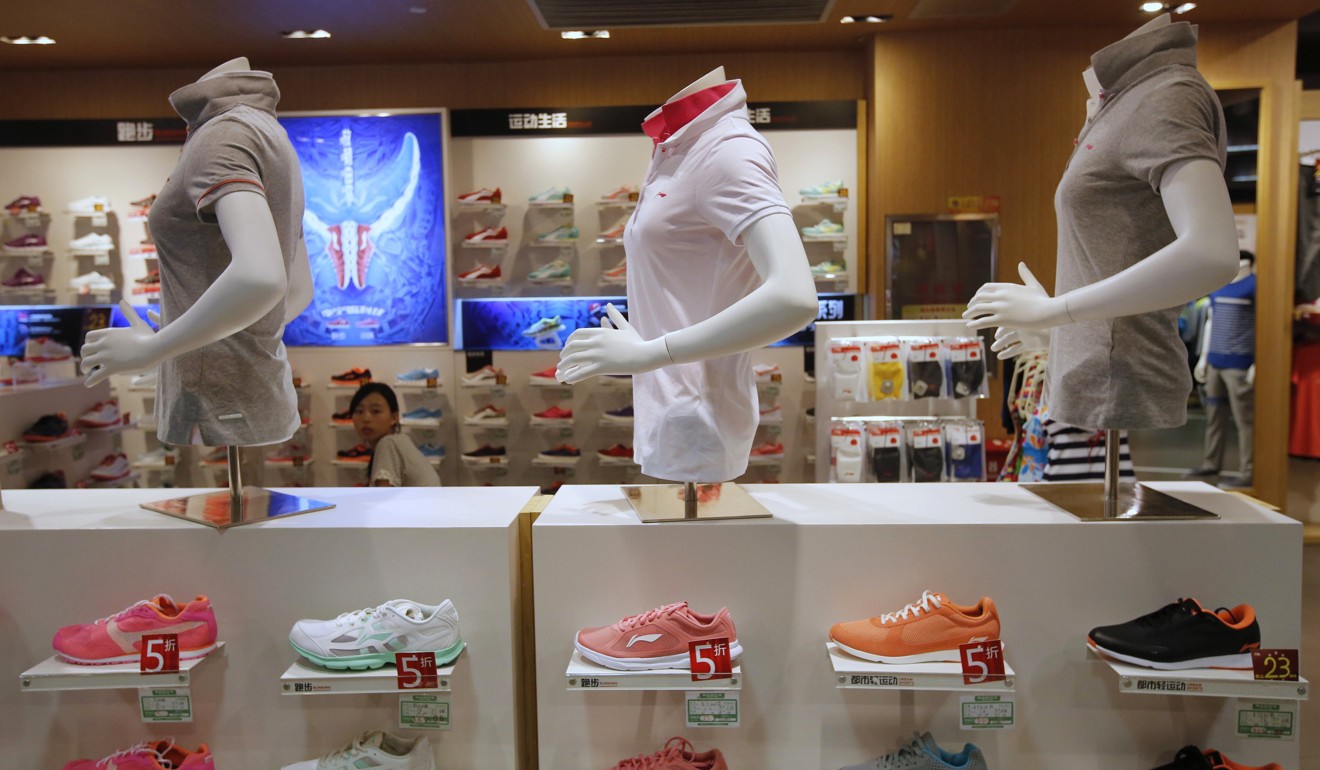 Shelves displaying Li Ning shoes and shirts seen at a store in Beijing. Channel restructuring continues to yield results. Photo: Reuters