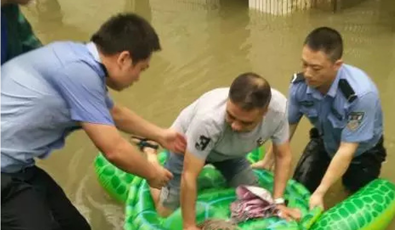 Chinese police use inflatable turtle to rescue 13 people trapped by flood