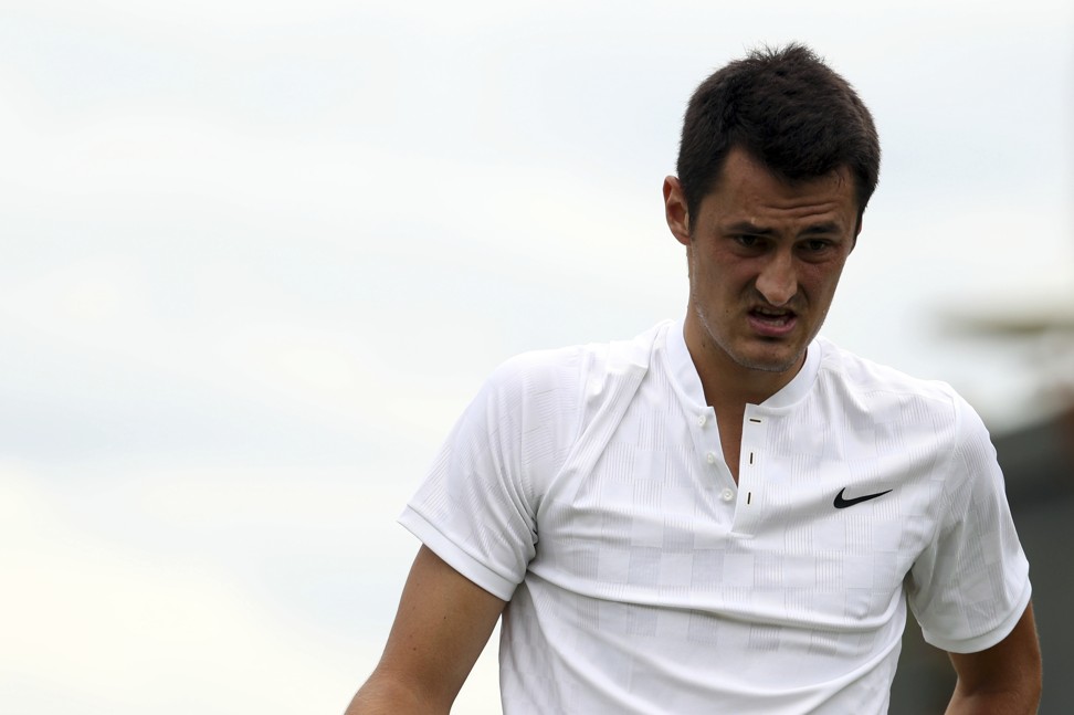 Tomic looks on during his defeat by Germany’s Mischa Zverev. Photo: AP