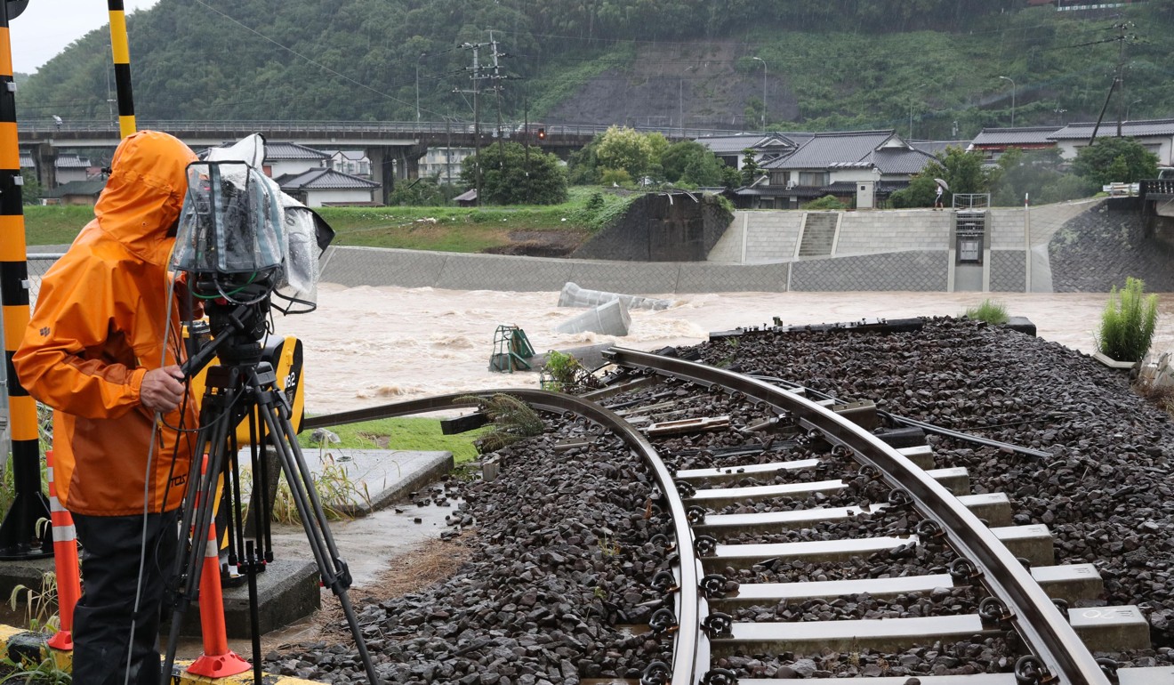 A railway bridge over a river was washed away in the city of Hita. Photo: Kyodo