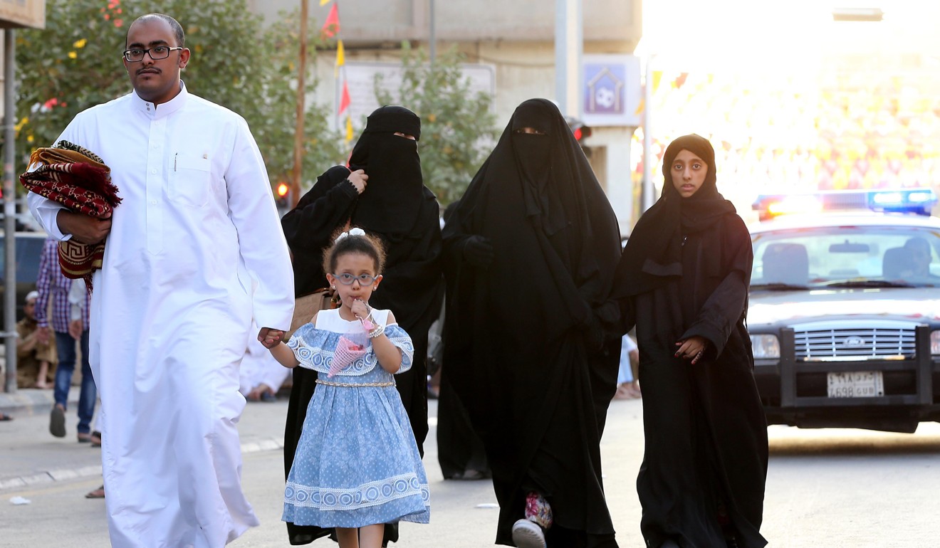 Saudi women and children walk after celebrating Eid al-Fitr prayers, in the courtyard of a mosque Prince Turki bin Abdul Aziz in Riyadh, Saudi Arabia. Photo: EPA