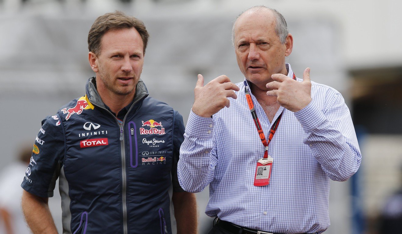 Former McLaren chairman and chief executive officer Ron Dennis (right) talks with Red Bull Racing Team chief Christian Horner. Photo: EPA